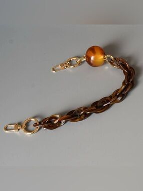 Lulla Collection acrylic tortoiseshell chain purse strap with gold-tone hardware